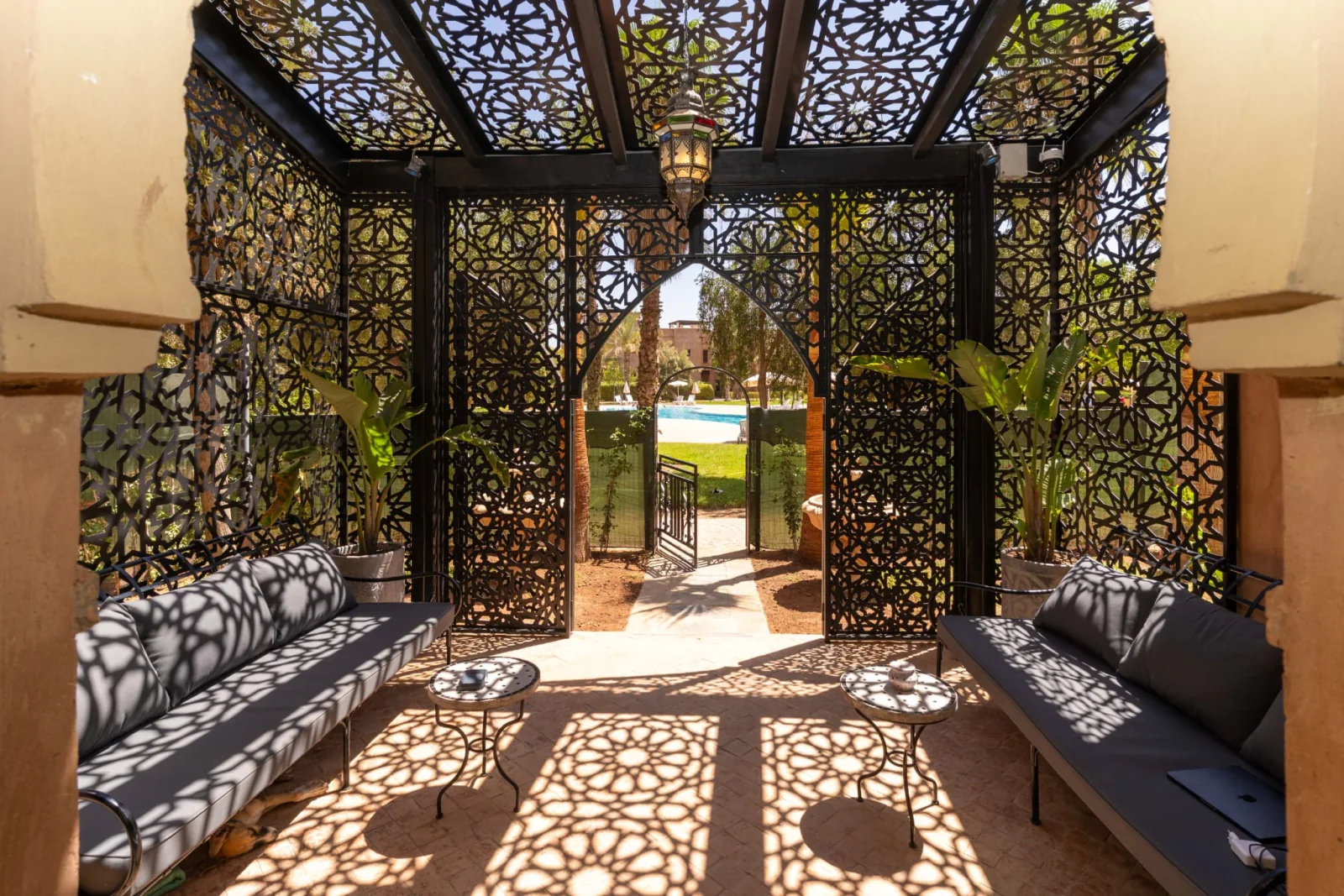 Private courtyard in the sunshine with patterned screen shadows