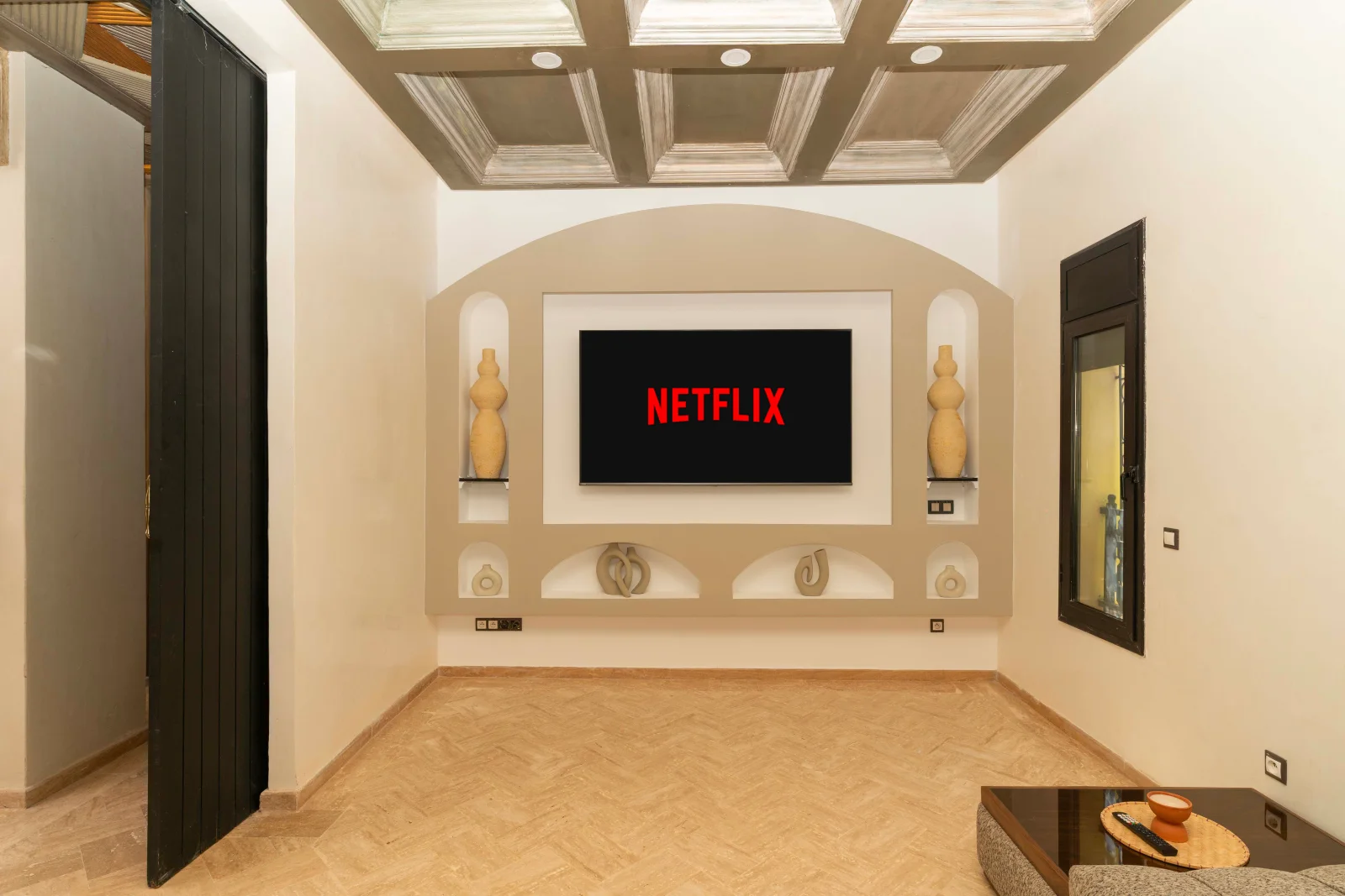 Large wall-mounted television in the living room’s illuminated surround